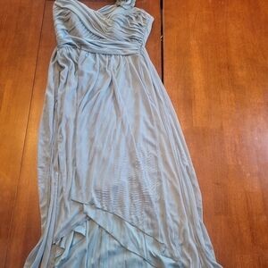 Turquoise one shoulder dress worn in a wedding.